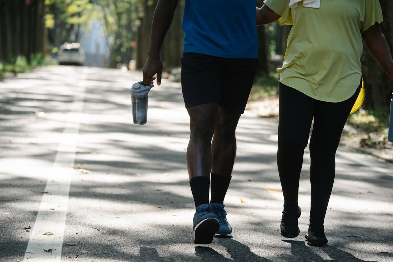 People Walking on the Street while Holding Tumblers